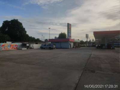 Gas station with empty land at the back 
