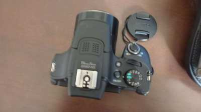 MINT Canon PowerShot SX60 HS 16.1MP 65x Optical Zoom with tripod.