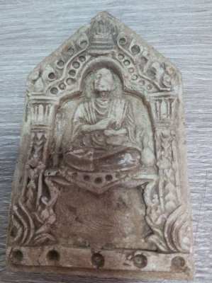 A old Thai plaque showing a monk