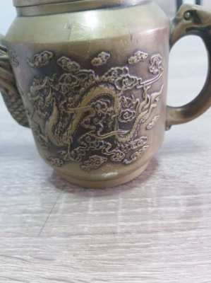 Beautifull bronze teapot decorated with dragons