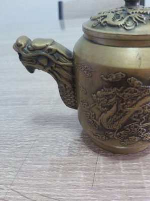 Beautifull bronze teapot decorated with dragons