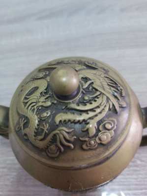 Beautifull bronze teapot decorated with dragons