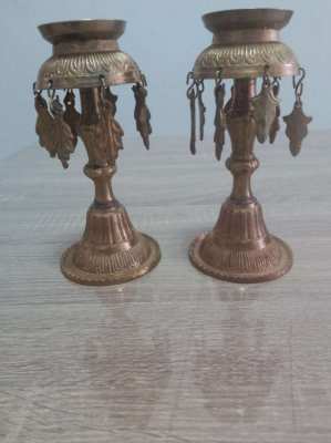 A pair of old Indian candle holders