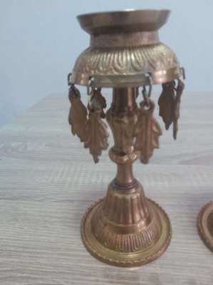 A pair of old Indian candle holders