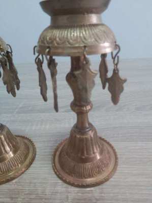 A pair of old Indian candle holders