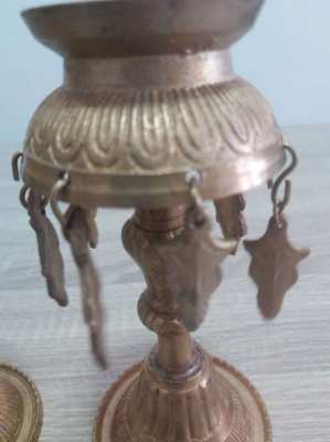 A pair of old Indian candle holders