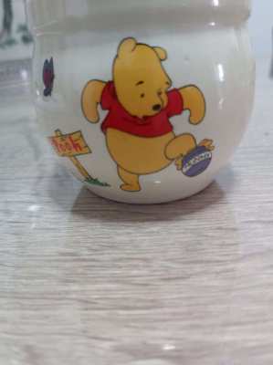 A set of 4 highly collectable Disney winnie the pooh honey pots