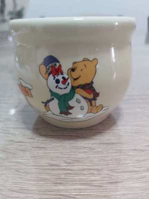 A set of 4 highly collectable Disney winnie the pooh honey pots