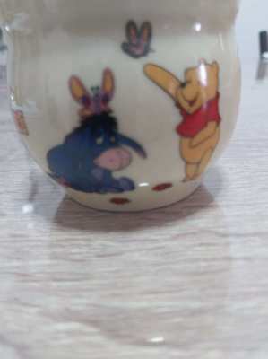 A set of 4 highly collectable Disney winnie the pooh honey pots