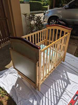 Baby Cot, wooden in very good condition complete with bedding