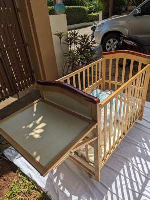 Baby Cot, wooden in very good condition complete with bedding