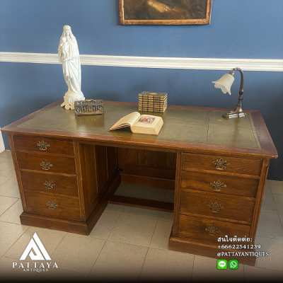 Antique English bureau with green leather top and 8 drawers