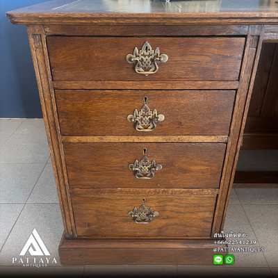 Antique English bureau with green leather top and 8 drawers