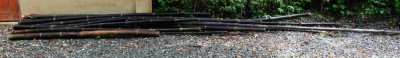 Several black bamboo poles are available for 100 B.