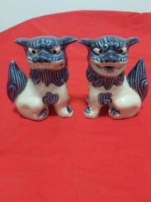 A superb pair of chinese/japanese blue and white foo/fo dogs