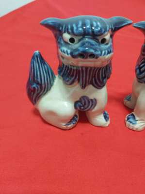 A superb pair of chinese/japanese blue and white foo/fo dogs