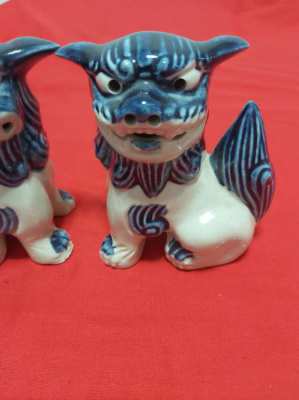 A superb pair of chinese/japanese blue and white foo/fo dogs