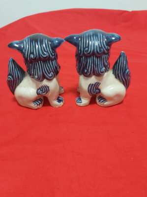 A superb pair of chinese/japanese blue and white foo/fo dogs