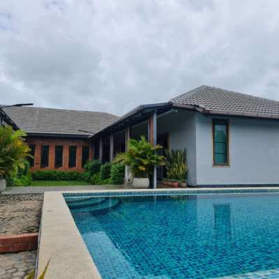 Modern detached luxury villa with a private pool for sale.