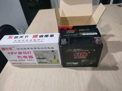 2 Nd hand Motorcycle battery and new charger for sale