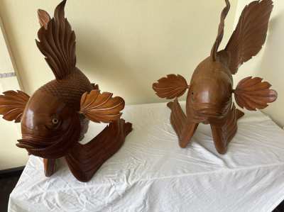 Beautiful wooden sculptures of two Koi carps