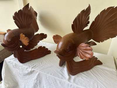 Beautiful wooden sculptures of two Koi carps