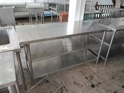 Stainless steel table under shelf