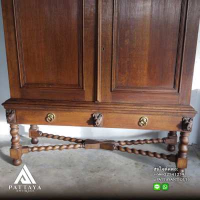 An Antique Dutch Colonial Oak Twisted Cross-Legged Cabinet