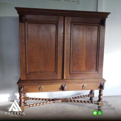 An Antique Dutch Colonial Oak Twisted Cross-Legged Cabinet